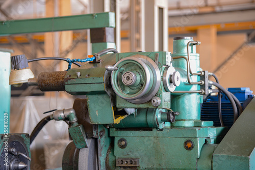 Grinding machine at a machine-building enterprise in a metalworking workshop.