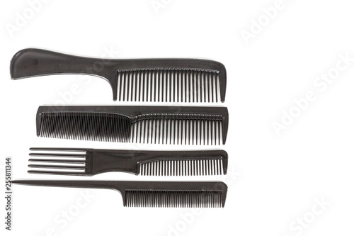 hair tools  beauty and hairdressing concept - different combs on white background