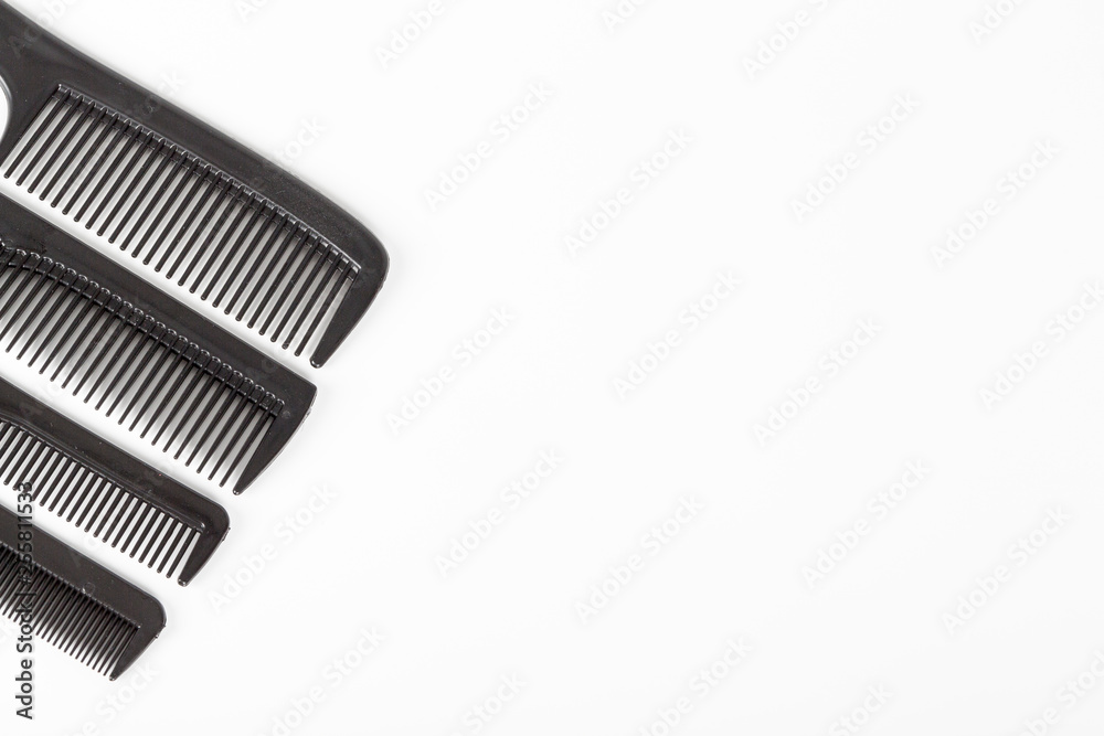 hair tools, beauty and hairdressing concept - different combs on white background hair tools, beauty and hairdressing concept - different combs on white background