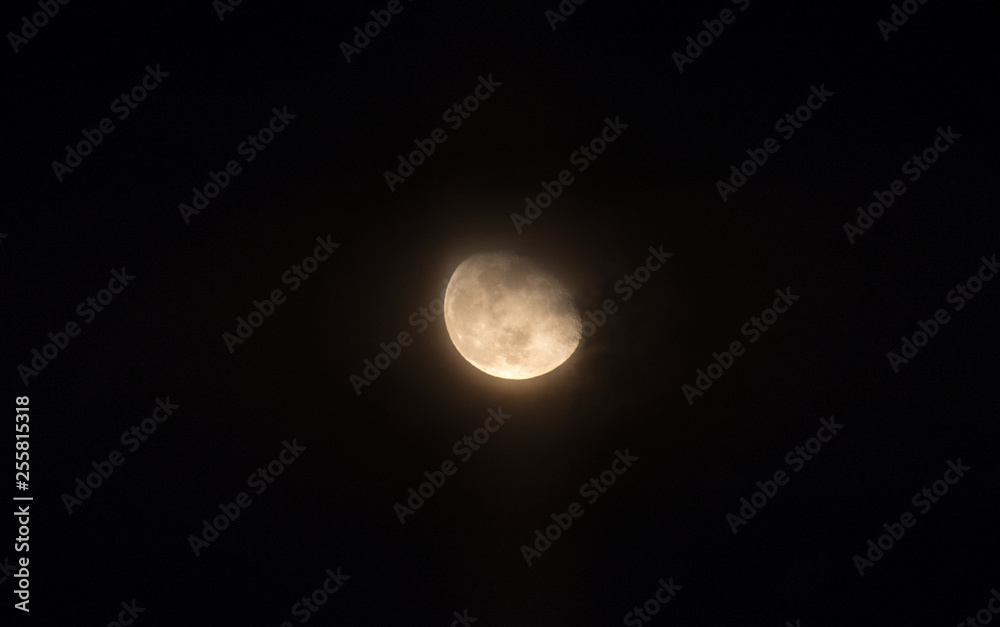 Moon through the clouds at night, super moon Moon through the clouds at night, super moon