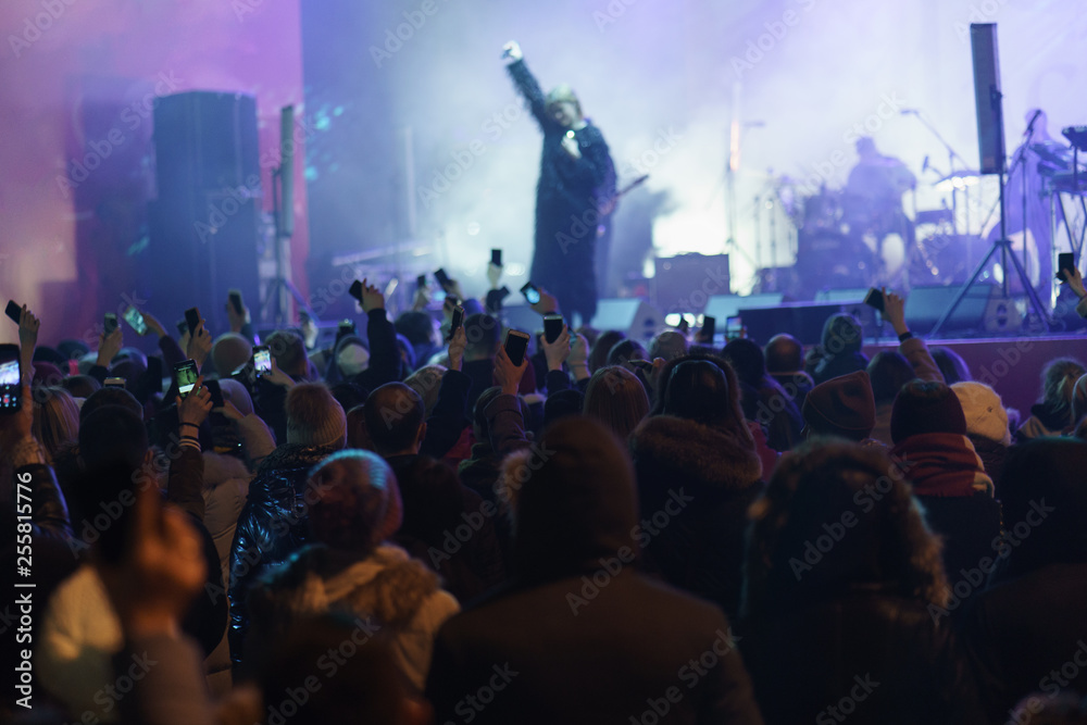 Defocused image. Street life at night. Open Air Show at Moscow street. 