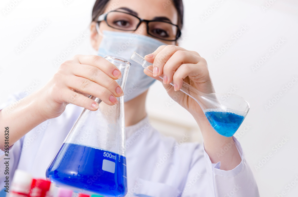 Young female chemist working in the lab Young female chemist working in the lab