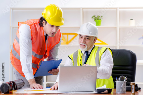 Two engineers colleagues working under project 