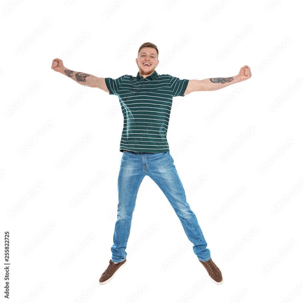 Handsome young man jumping on white background Handsome young man jumping on white background