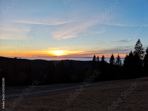 Sonnenuntergang im Schwarzwald mit Nebel im Rheintal photo