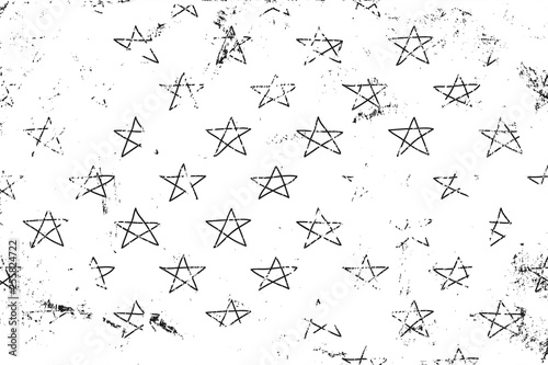 Grunge pattern with sketches stars on the scratches surface. Horizontal black and white backdrop.