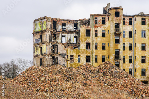 demolition of a large old historic stone house in the city © Zigmunds