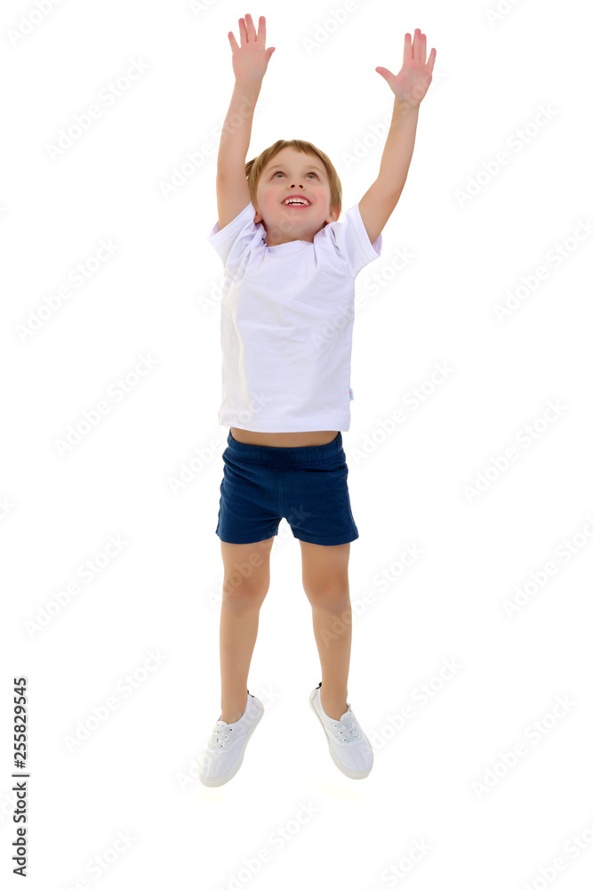 A little boy in a clean white T-shirt is jumping fun. A little boy in a clean white T-shirt is jumping fun.