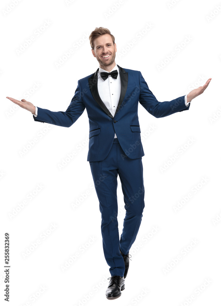 positive guy in blue suit greeting with hands positive guy in blue suit greeting with hands