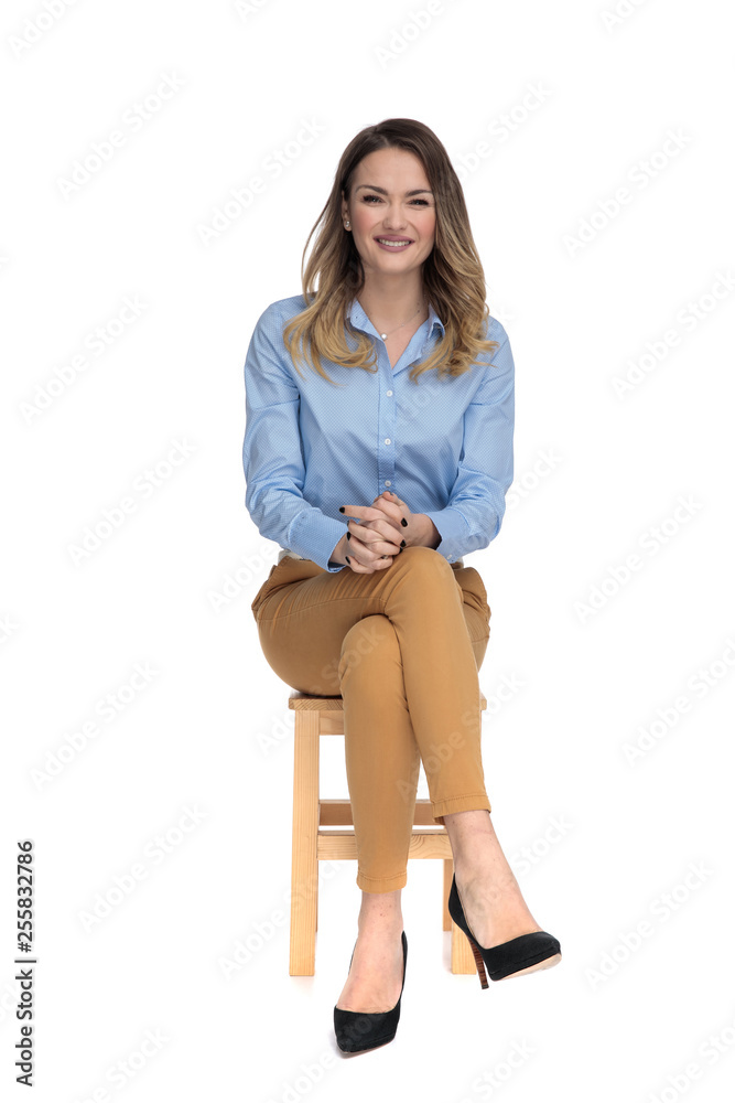 young casual dressedwoman sitting and waiting for interview