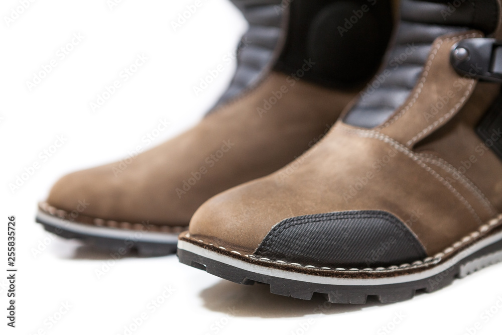 Toe-cap of motorcycle boots for motorcross riding, isolated on a white background Toe-cap of motorcycle boots for motorcross riding, isolated on a white background