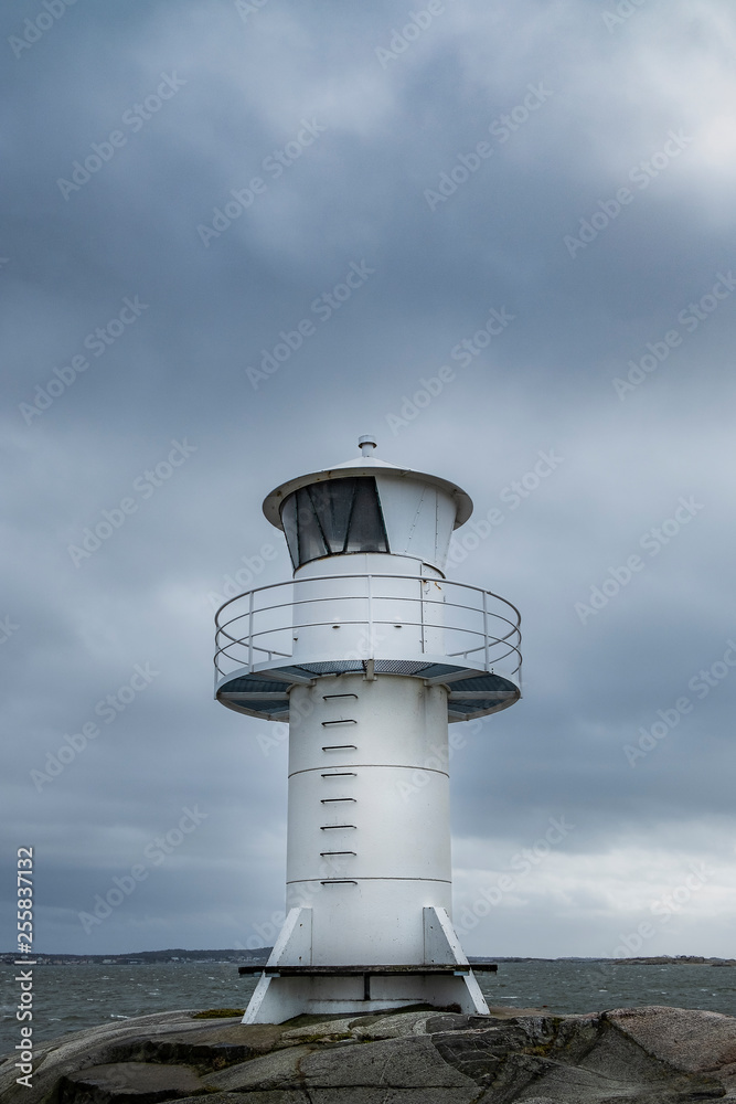 Lighthouse by the stormy ocean in  Sweden