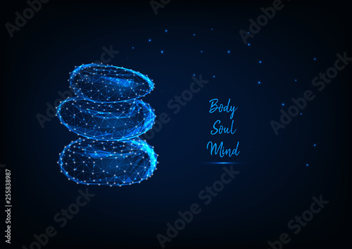 Glowing low polygonal three zen stones with words body, soul, mind.