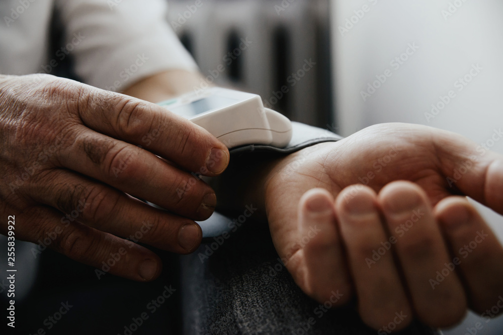 Blood pressure testing with a blood pressure meter. A blood ...