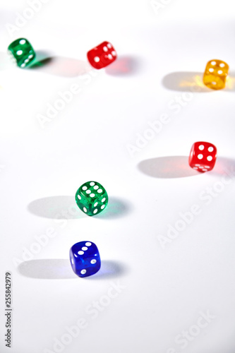 colorful dices in motion on white background