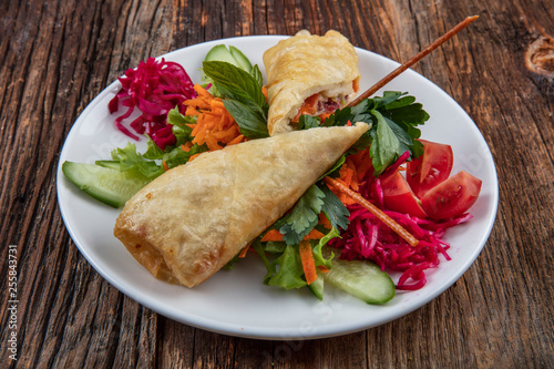 Turkish Pacanga Boregi with pastirma (pastrami) and cheddar (melted) cheese. / Pastirmali Borek photo