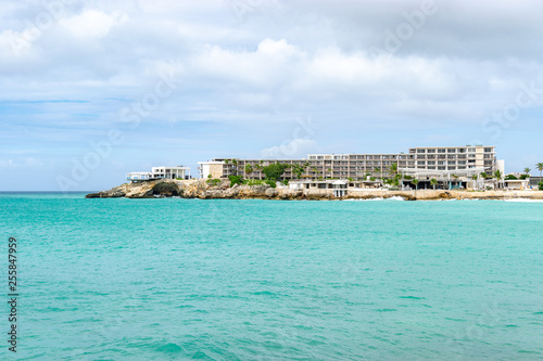 Fototapeta Naklejka Na Ścianę i Meble -  Hotel/ Apartment building on cliff side of tropical Caribbean island