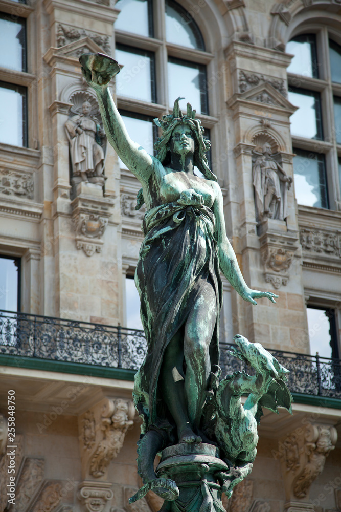 bronze statue at the fountain of town hall hamburg germany