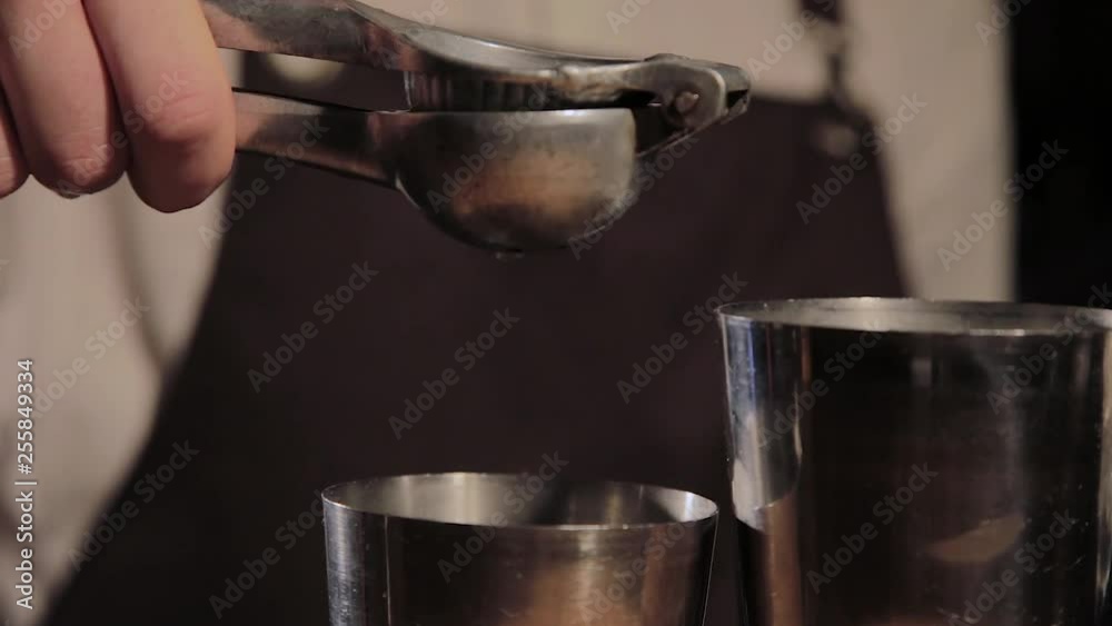 The process of preparing an alcoholic cocktail at the bar.