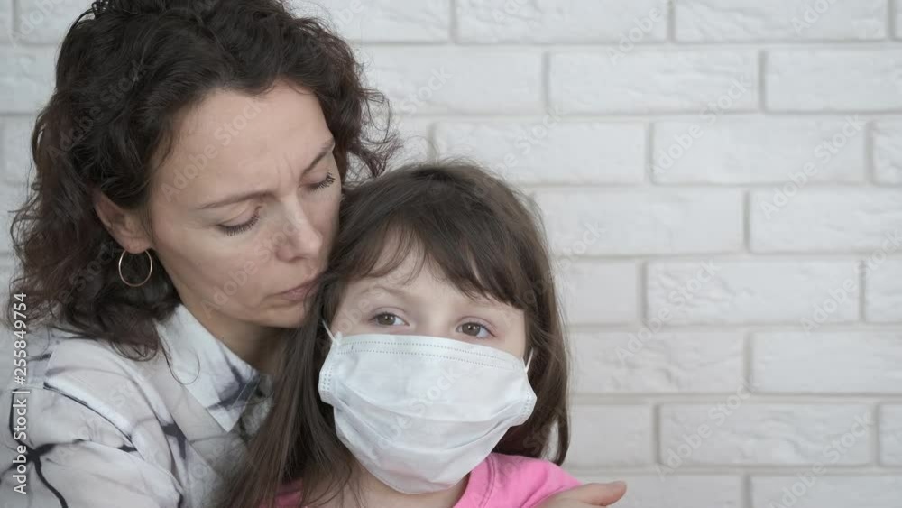 A child in a sterile mask.