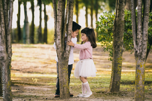 Girl and boy in the park. Face to face