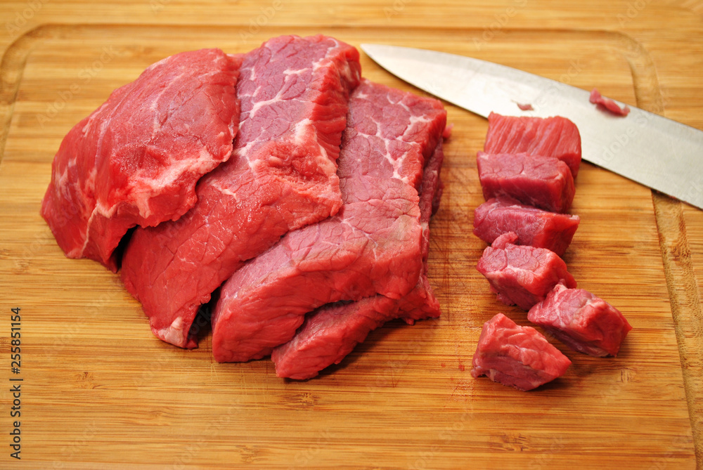 Raw Lean Beef Roast Cut into Steaks