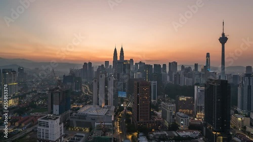KUALA LUMPUR, MALAYSIA - MARCH 17, 2019: 4K Cinematic Sunrise Time Lapse Footage of Kuala Lumpur city skyline from the west side of the Malaysian capital.
