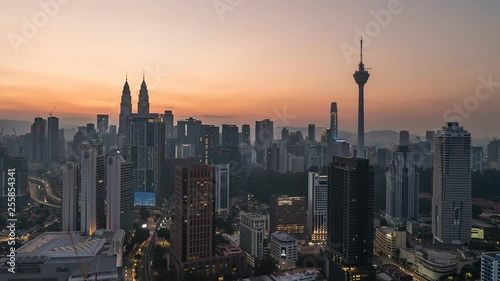KUALA LUMPUR, MALAYSIA - MARCH 17, 2019: 4K Cinematic Sunrise Time Lapse Footage of Kuala Lumpur city skyline from the west side of the Malaysian capital.