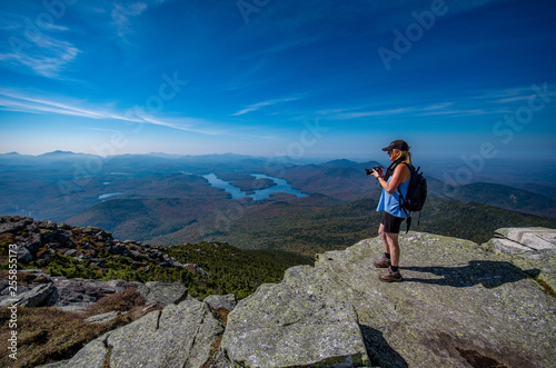 Принти на полотні female hiker enjoying the view from the summit of Whiteface Mountain