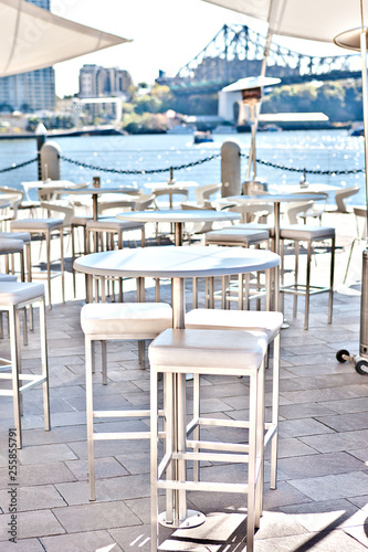 Close view of the round white chairs and tables