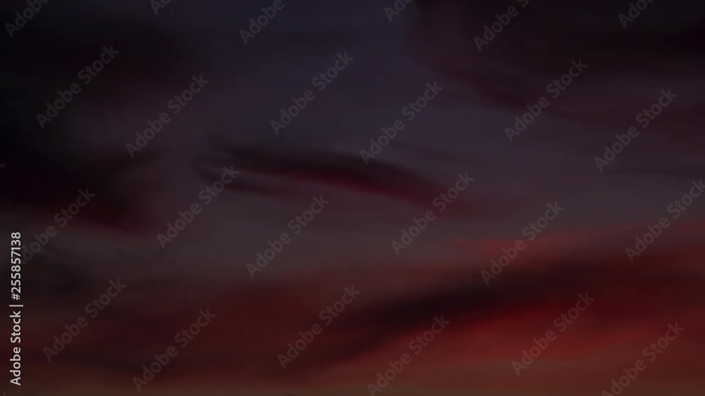 Vibrant red and magenta sky at sunset with dark clouds time lapse Vibrant red and magenta sky at sunset with dark clouds time lapse