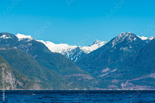 Burrard Inlet  ocean and island with mountains in beautiful British Columbia. Canada.