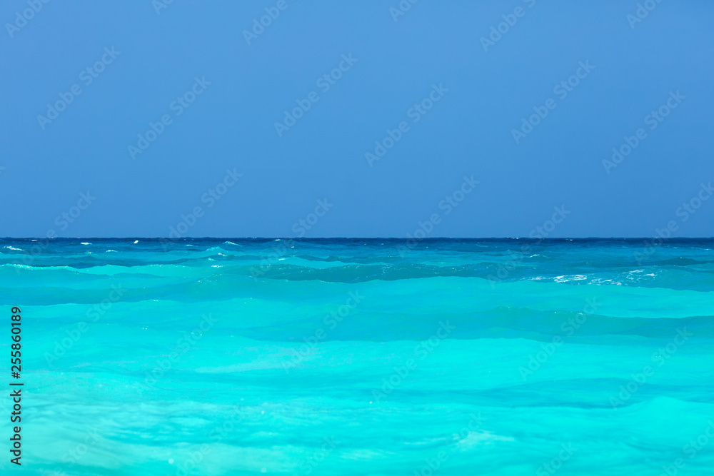 Tropical turquoise sea and clear blue sky.