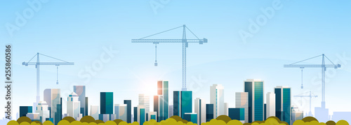 modern city construction site tower cranes building residential buildings cityscape sunset skyline background flat horizontal banner