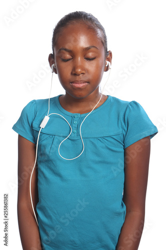 Girl eyes closed earphones in listening to music