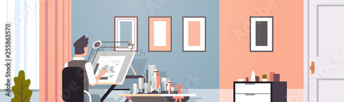 architect drawing blueprint urban building plan on adjustable board panning project concept engineer sitting workplace office draftsman studio interior horizontal portrait