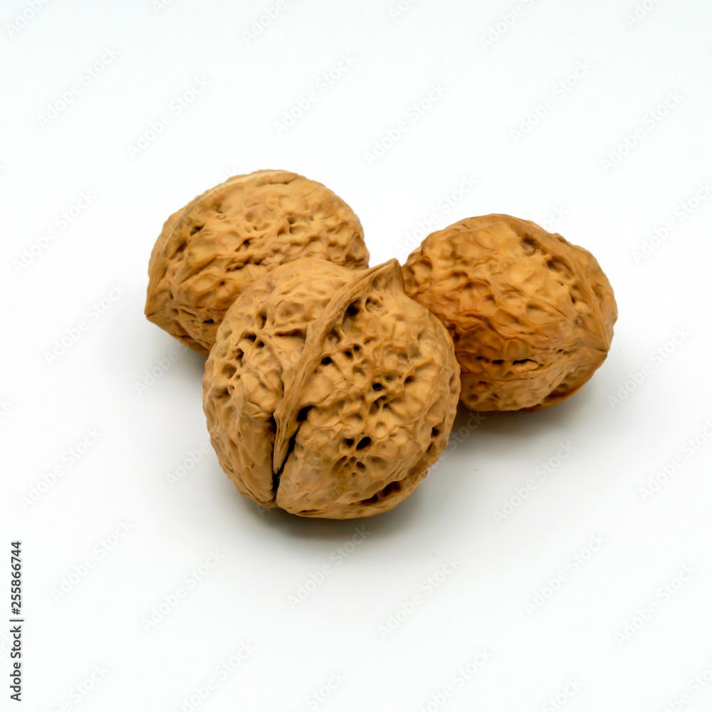 Three Walnuts Isolated on a White Background. Three Walnuts Isolated on a White Background.