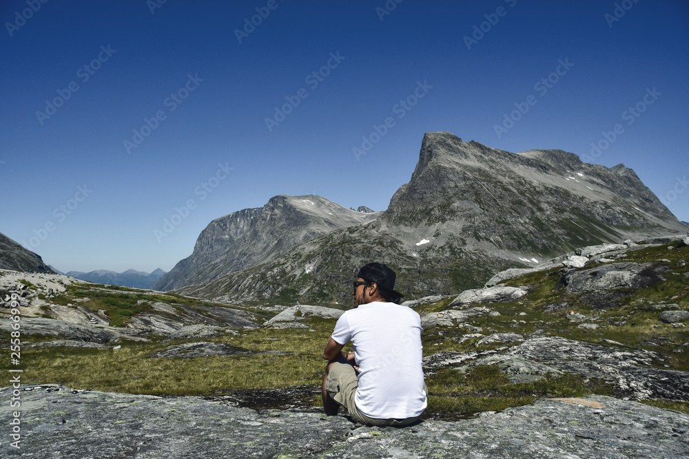 man looking to mountain