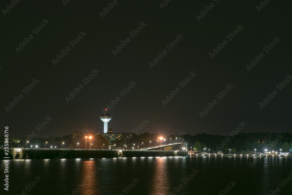 Nighttime over Tennessee River between Muscle Shoals and Florence, Alabama with the Renaissance Tower and Wilson Dam