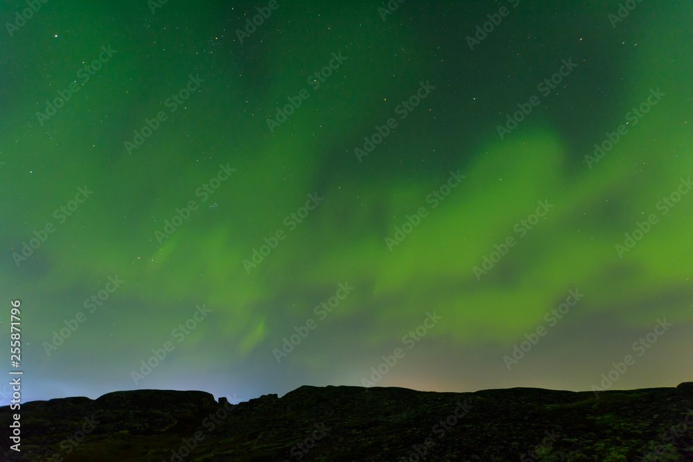 Green northern lights over the hills, aurora. Green northern lights over the hills, aurora.