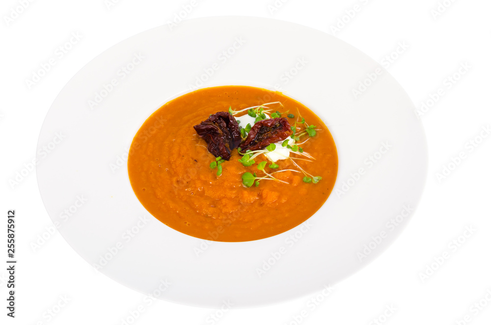 Carrot pumpkin cream soup in white plate. Carrot pumpkin cream soup in white plate.