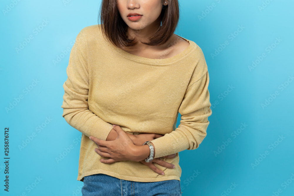 © suriya - asian young woman having painful stomachache