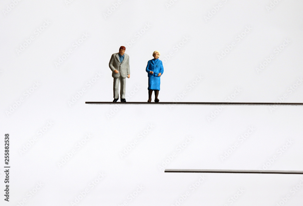 The concept of an aging society. Miniature people.