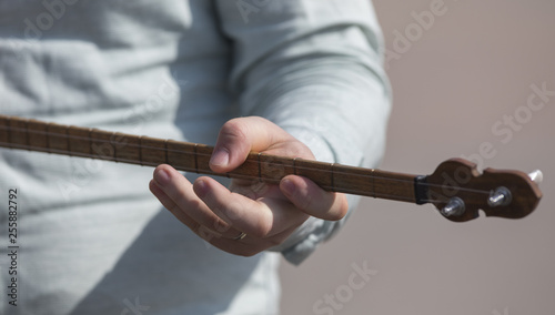 playing the kazakh musical instrument dombra