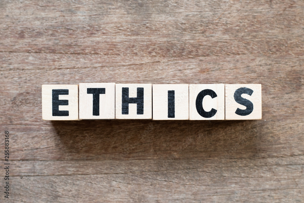 Letter block in word ethics on wood background Letter block in word ethics on wood background