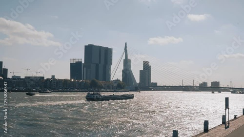 Boot varend door de Maas in Rotterdam / Boat sailing through Rotterdam photo