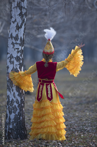 dancing girl in Kazakh costume photo