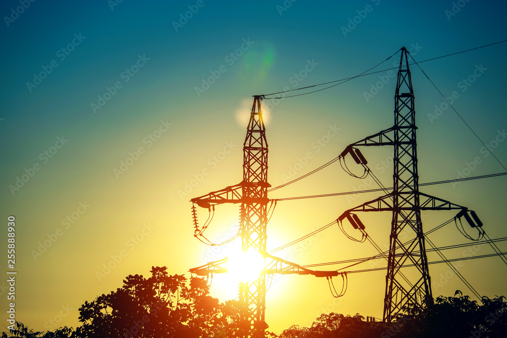 Tower with high voltage lines and beautiful sunrise