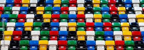Many rows of bright colorful plastic seats, grandstand stadium, for background