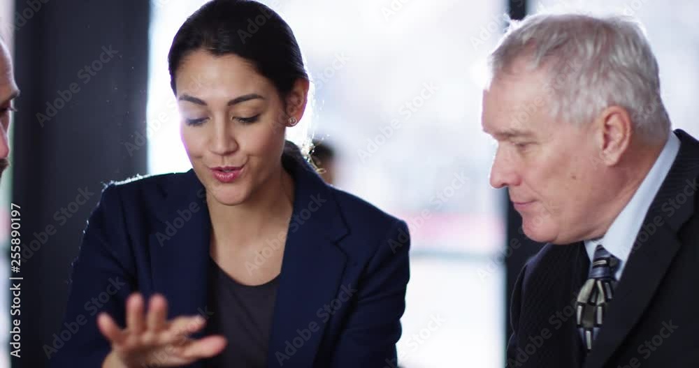 4K Business team looking at digital tablet, discussing the business strategy 4K Business team looking at digital tablet, discussing the business strategy